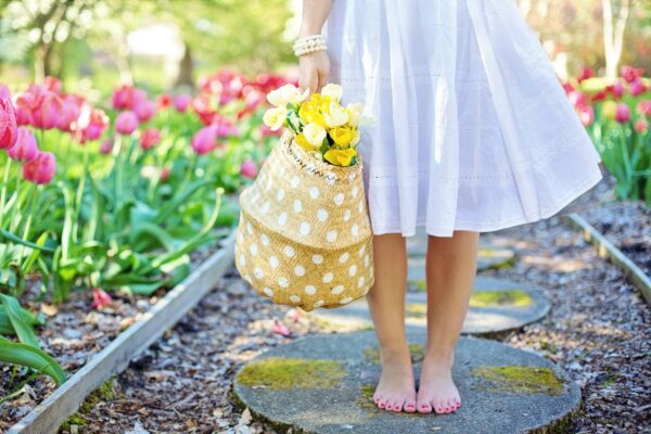 Hail Spring! And The Freebies That Come With It woman holding brown basket with yellow flowers